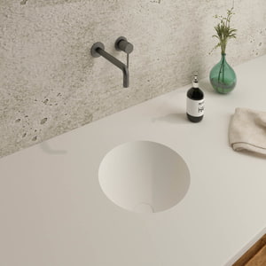 eingelassenes weißes rundes Waschbecken in die Waschtischplatte